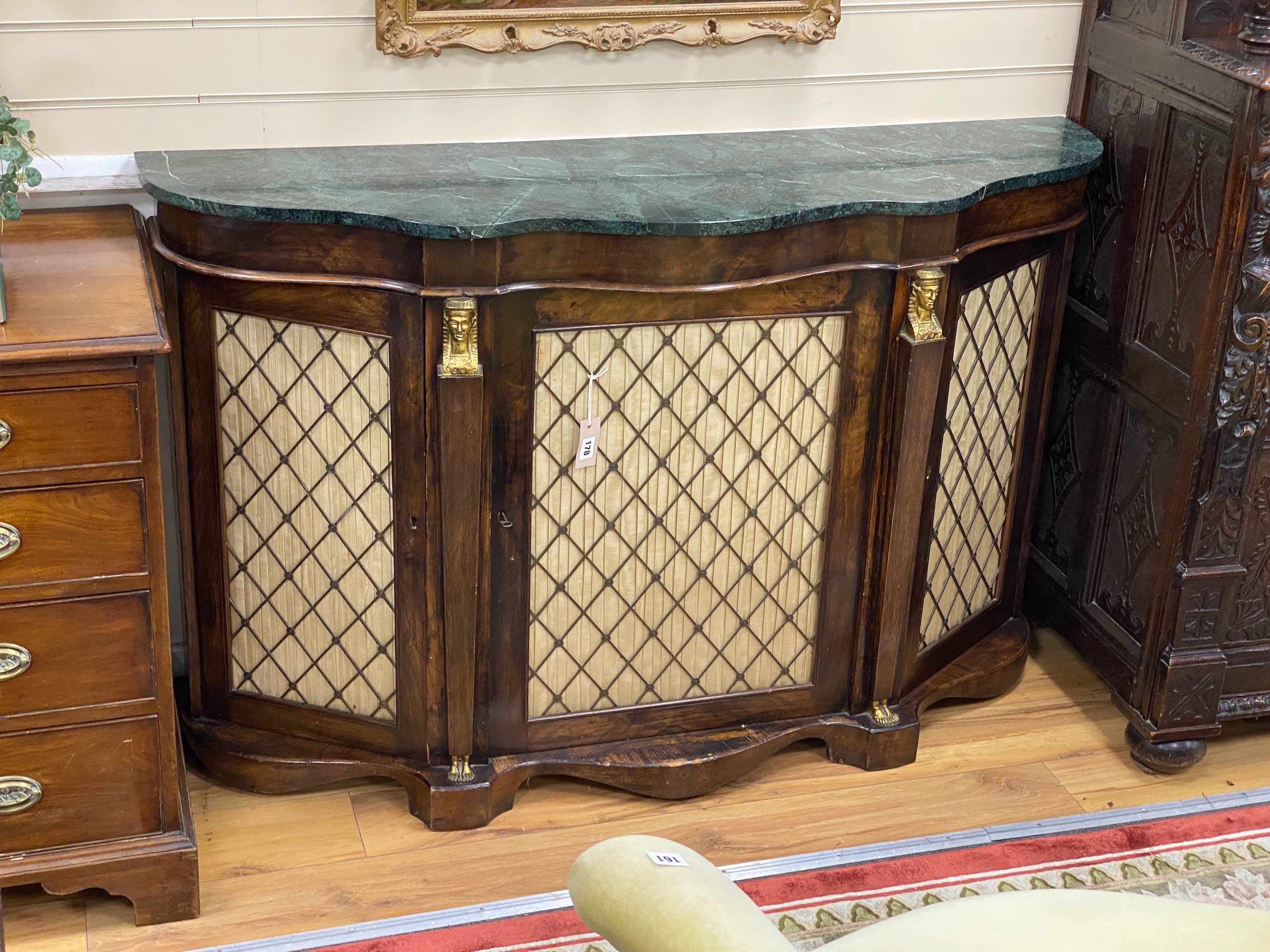 A Victorian serpentine front marble top walnut side cabinet, (marble split), width 136cm, depth 39cm, height 87cm